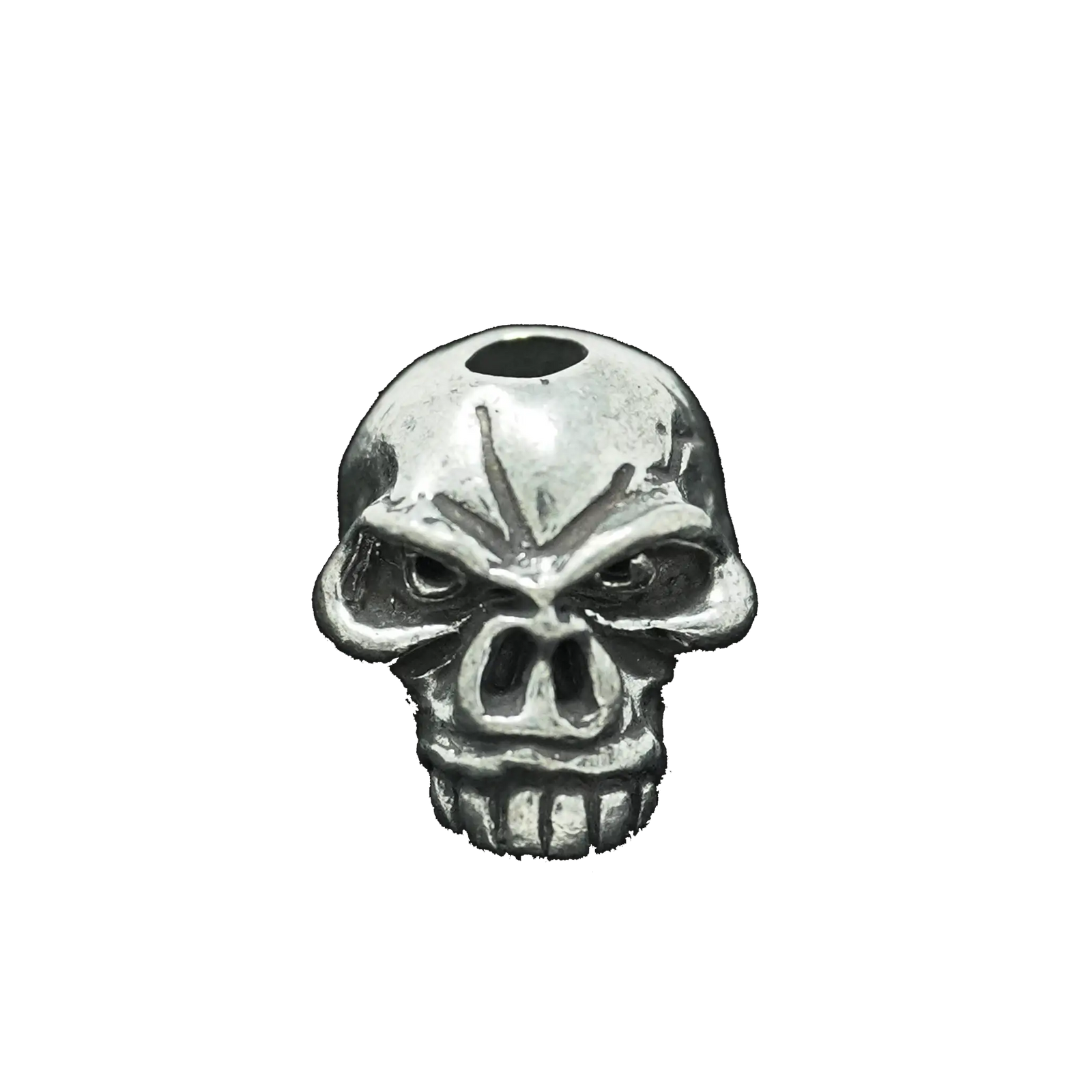 The Emerson Skull Bead by Emerson Knives, Inc. features a metallic finish, a hole on top, dark eye sockets, and prominent teeth, displayed against a plain white background.
