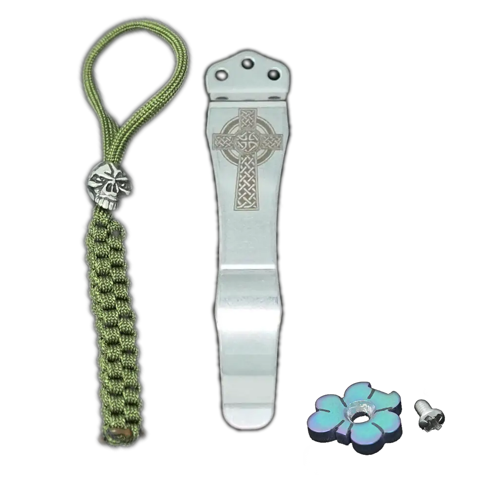 Three items: a 45 green shamrock shaped thumb button, a silver pocket clip with an Irish cross, and a green lanyard with a silver skull.