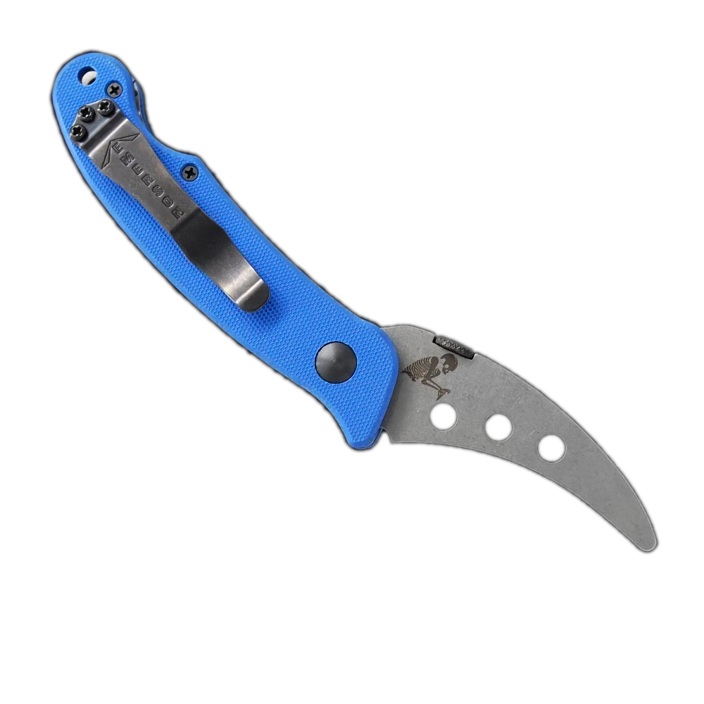 The Elvia Trainer by Emerson Knives, Inc. is a folding knife with a curved hawkbill blade featuring three holes, a blue textured handle with black screws and thumb stud—perfect for daily protection or survival use.