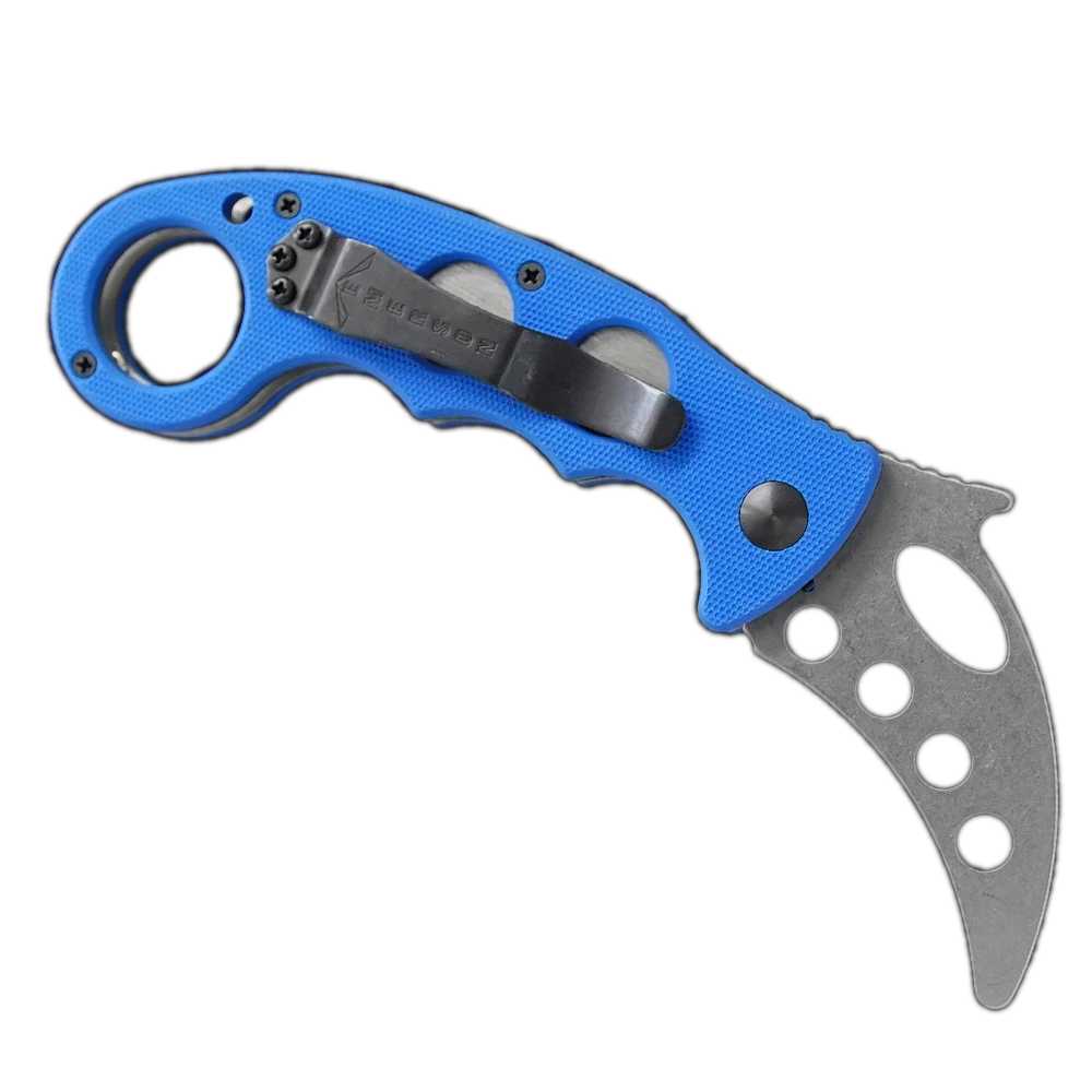 The Emerson Knives, Inc. Karambit Trainer is a folding knife with a curved, hole-punched blade and a blue finger-grooved handle with an end ring—perfect for safe edged weapon training. Shown against a white background.